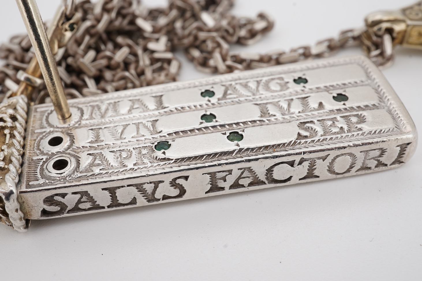 Two modern parcel gilt silver replicas of the Canterbury Pocket Sundial, the larger inset with small emeralds?, maker GF, London, 1975, the smaller later, maker DB, London, 1987, both suspended from a chain.